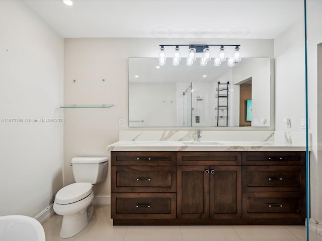 bathroom with vanity, a shower with shower door, toilet, and tile patterned floors