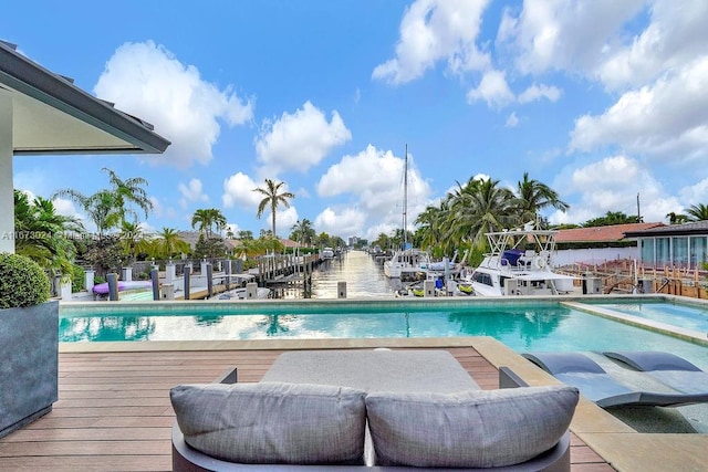 view of swimming pool featuring a water view