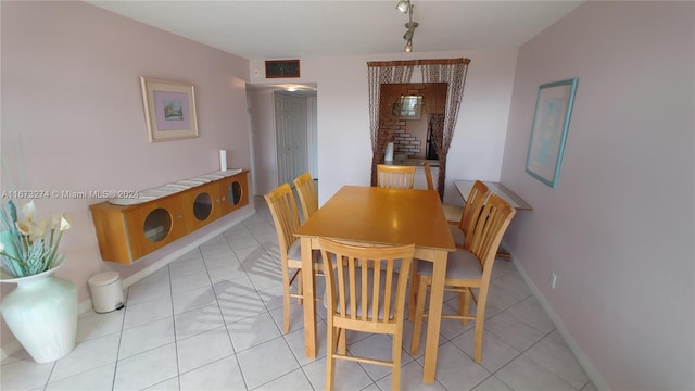 dining room featuring light tile patterned flooring