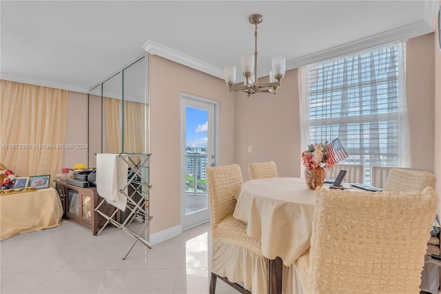 tiled dining room featuring ornamental molding and a chandelier