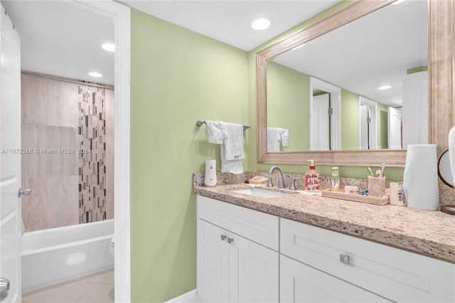 bathroom with vanity, shower / bath combo with shower curtain, and tile patterned floors