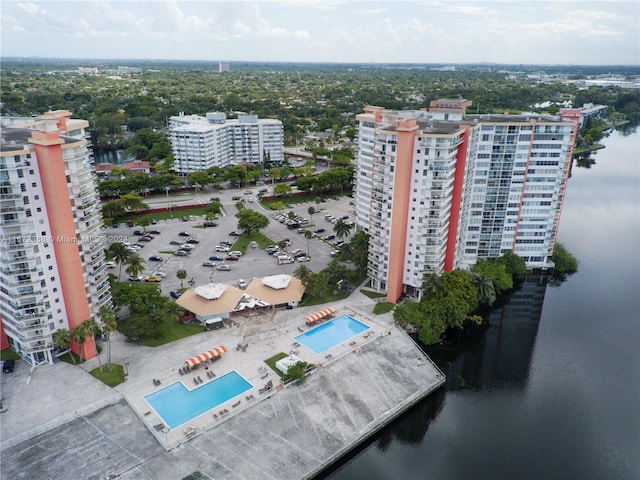 birds eye view of property featuring a water view