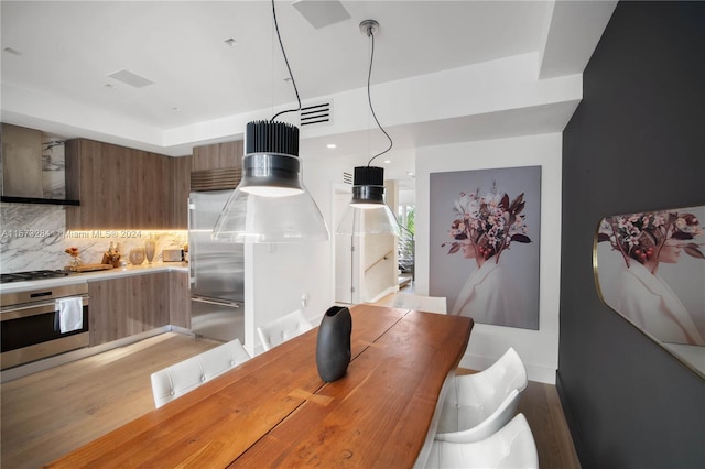 dining room with light hardwood / wood-style floors