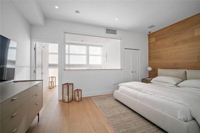 bedroom featuring a closet and light hardwood / wood-style floors