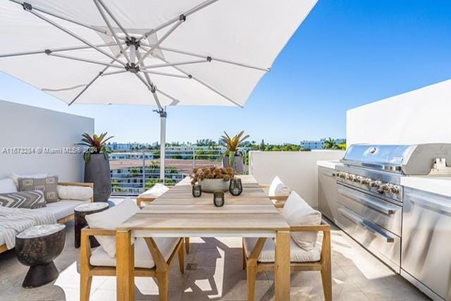 view of patio with an outdoor kitchen, outdoor lounge area, and area for grilling