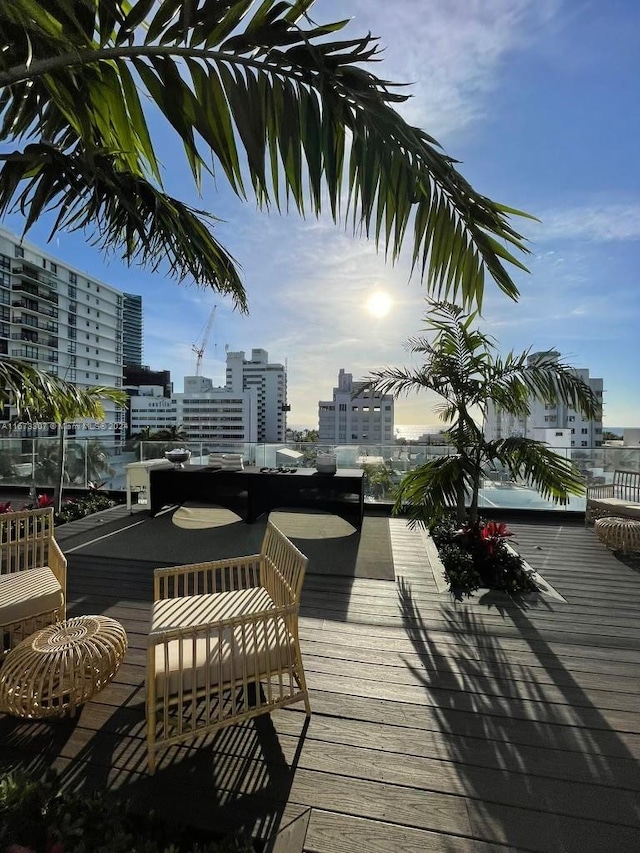 100 Golden Isles Dr Unit 605, Hallandale Beach, FL 33009 - wooden deck featuring a city view