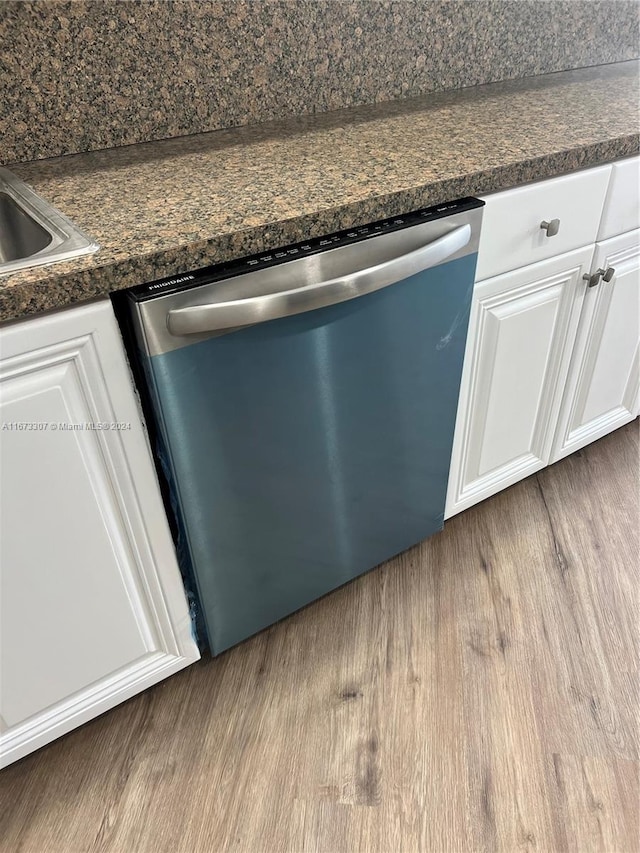 100 Golden Isles Dr Unit 605, Hallandale Beach, FL 33009 - details with white cabinetry, dark countertops, wood finished floors, and dishwasher