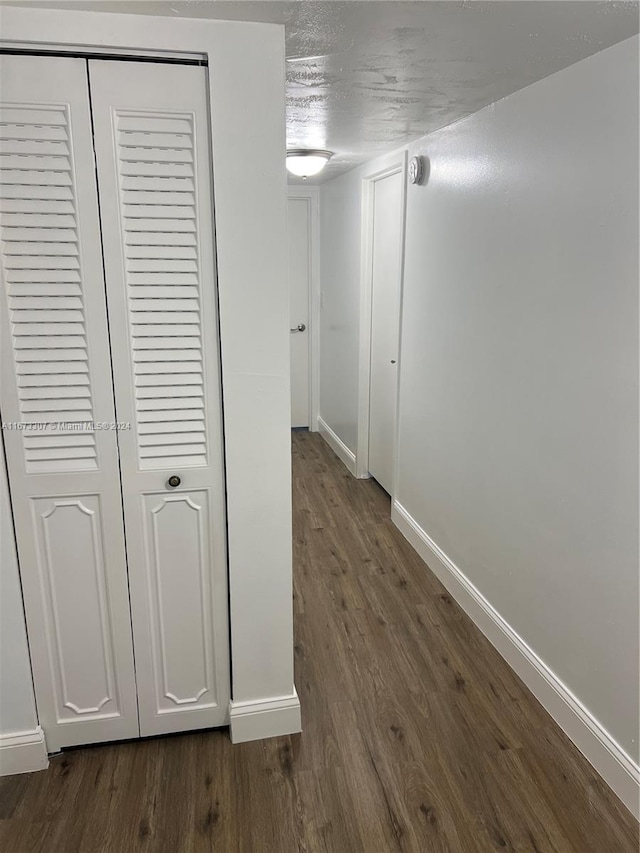 hallway featuring dark hardwood / wood-style floors