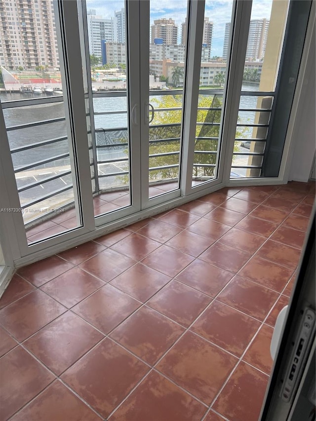 doorway with dark tile patterned flooring