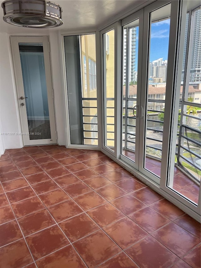 100 Golden Isles Dr Unit 605, Hallandale Beach, FL 33009 - interior space with dark tile patterned flooring and a city view