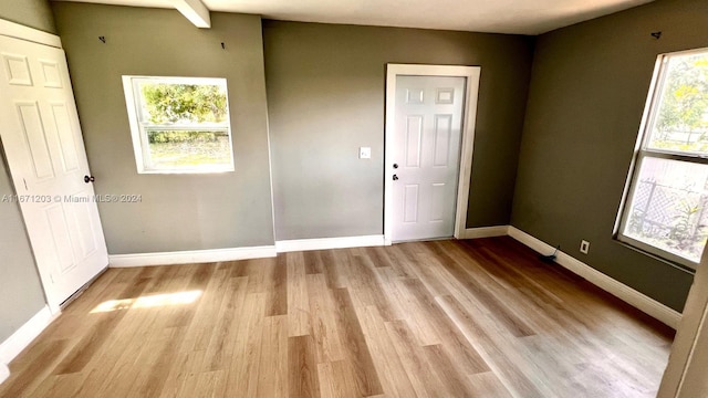 unfurnished room featuring light hardwood / wood-style floors