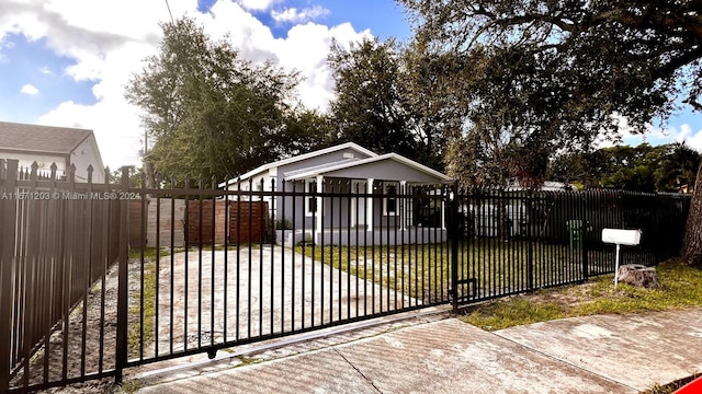 view of gate featuring a lawn