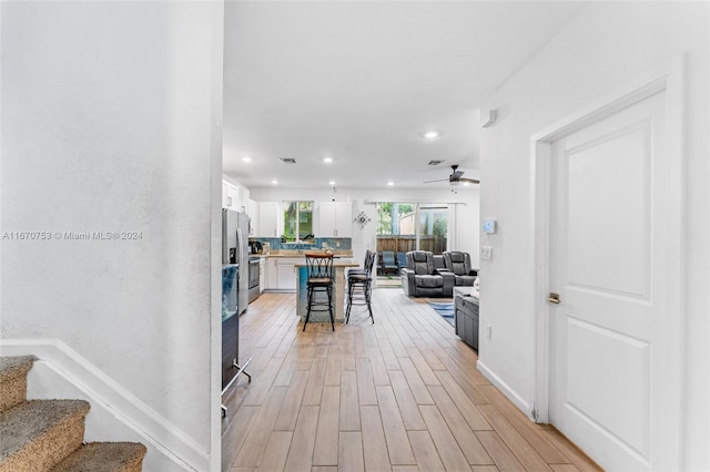 corridor featuring light hardwood / wood-style flooring