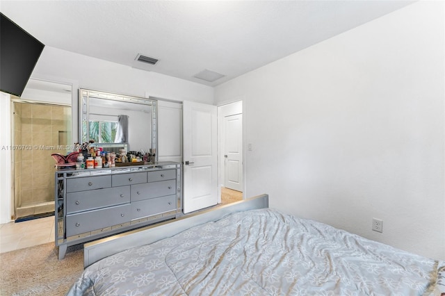 bedroom with light tile patterned floors