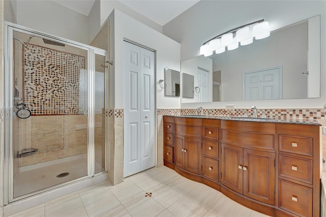 bathroom with vanity, tile patterned floors, and an enclosed shower