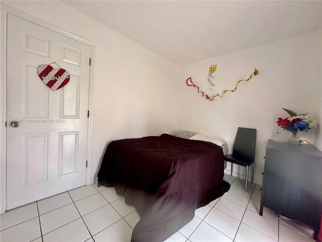 bedroom featuring light tile patterned floors