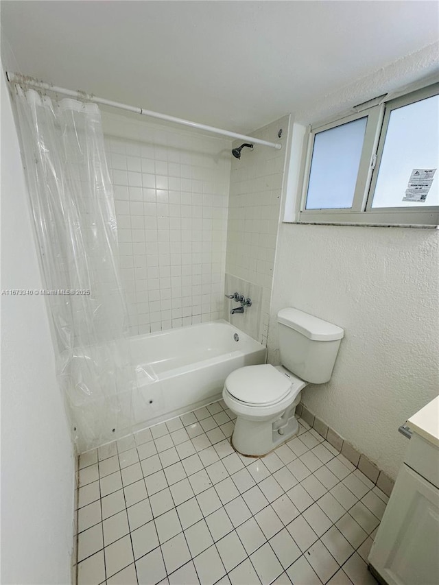 505 NW 177th St Unit 139, Miami Gardens, FL 33169 - bathroom featuring toilet, shower / bathtub combination with curtain, tile patterned floors, and vanity