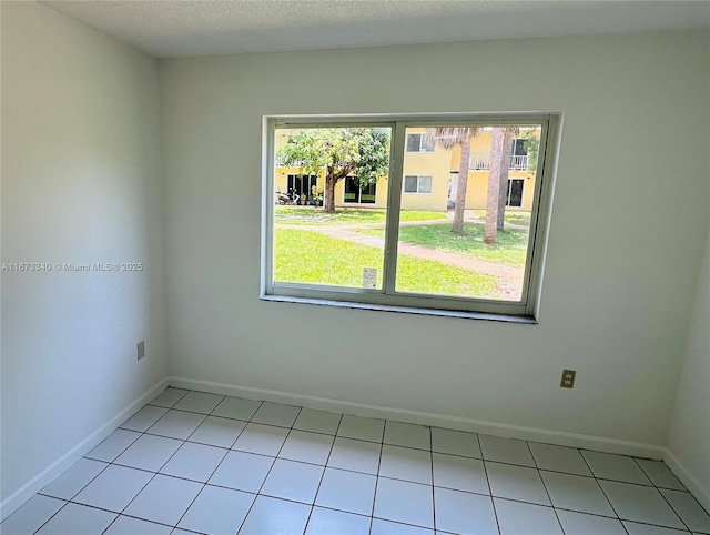 505 NW 177th St Unit 139, Miami Gardens, FL 33169 - unfurnished room with baseboards and light tile patterned floors