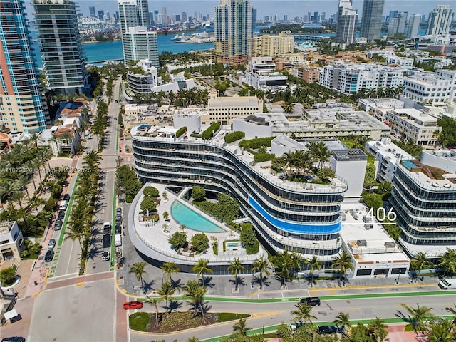 aerial view featuring a water view and a city view