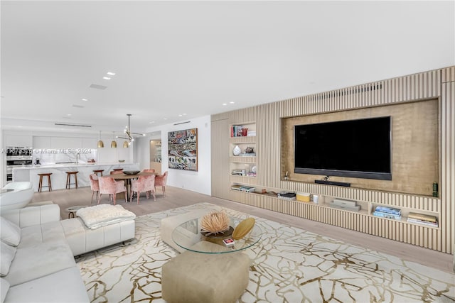 living room with light hardwood / wood-style floors