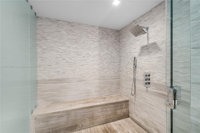 bathroom with tiled shower