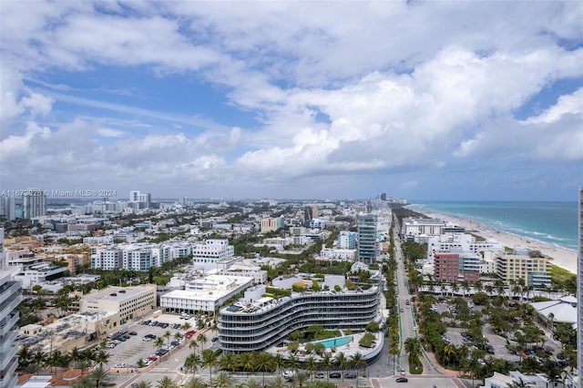 aerial view featuring a water view and a view of the beach