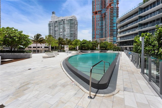 view of pool featuring a patio