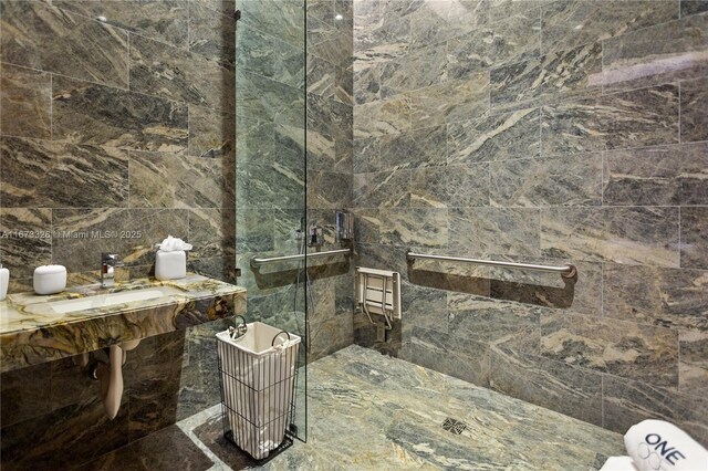 bathroom with tiled shower