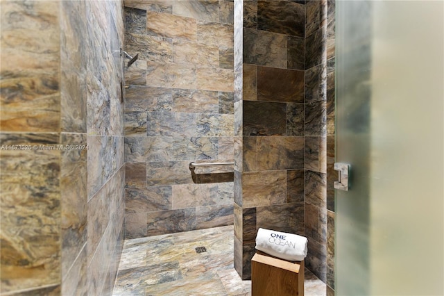 bathroom with tiled shower