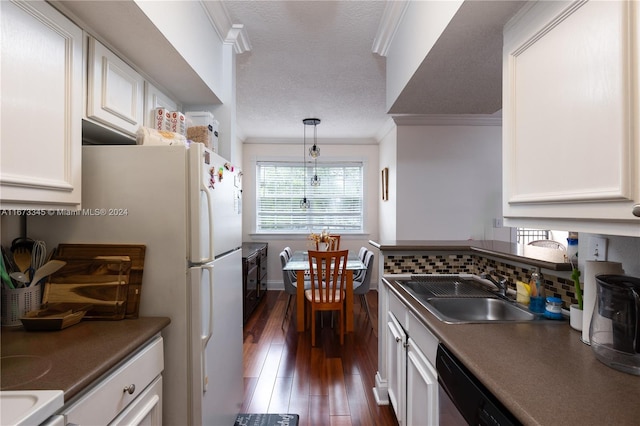 kitchen with white cabinetry, dark hardwood / wood-style flooring, crown molding, decorative light fixtures, and sink