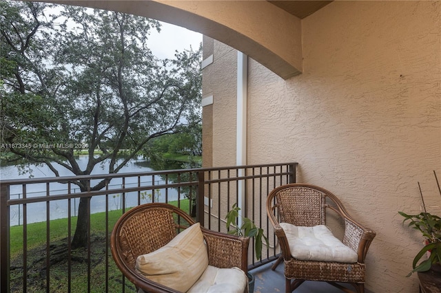 balcony featuring a water view