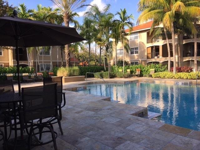 community pool featuring a patio