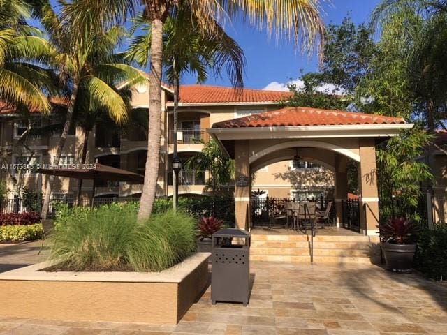 view of home's community with a patio area