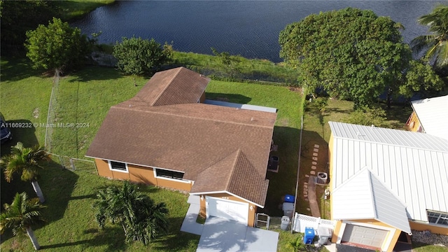 drone / aerial view with a water view