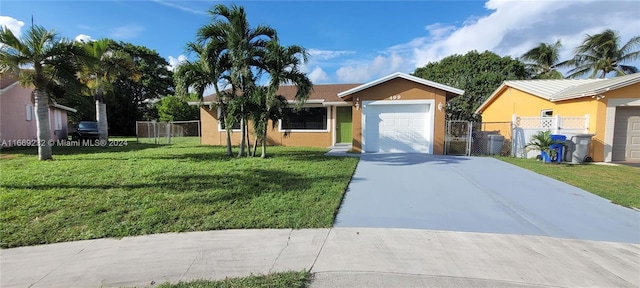 single story home with a front yard and a garage