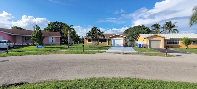 view of front of home featuring a garage and a front lawn