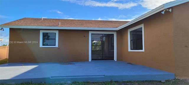 back of house with a patio