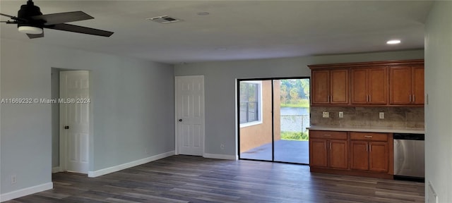 kitchen with backsplash, stainless steel dishwasher, ceiling fan, and dark wood-type flooring