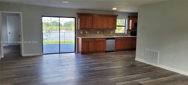 kitchen featuring decorative backsplash, dishwasher, dark hardwood / wood-style floors, and plenty of natural light