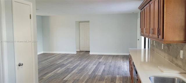 interior space with decorative backsplash and light hardwood / wood-style flooring