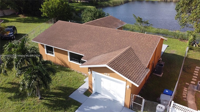 birds eye view of property featuring a water view