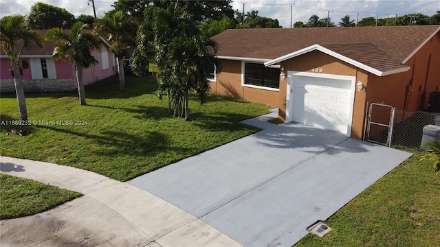 ranch-style home featuring a garage and a front yard