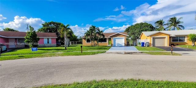 ranch-style house with a front yard and a garage