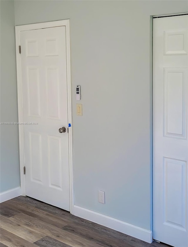 empty room with wood-type flooring