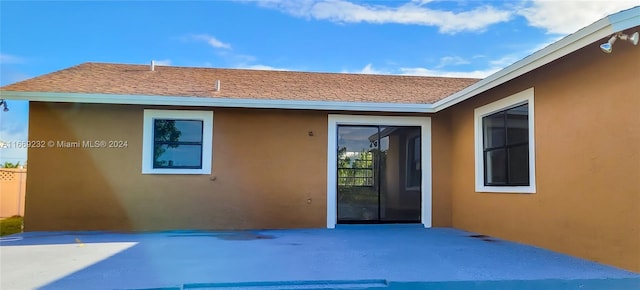 back of house with a patio