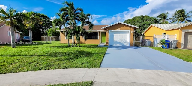 ranch-style home with a front yard and a garage