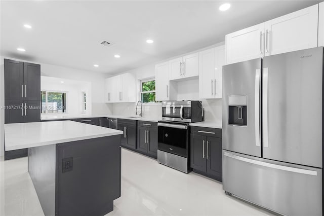 kitchen with backsplash, stainless steel appliances, and a healthy amount of sunlight