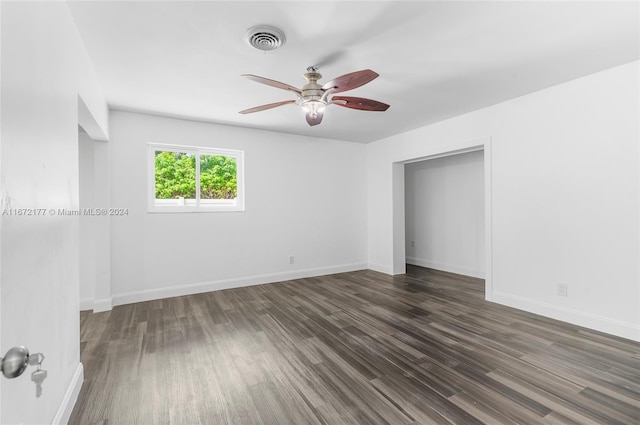 interior space with ceiling fan and dark wood-type flooring