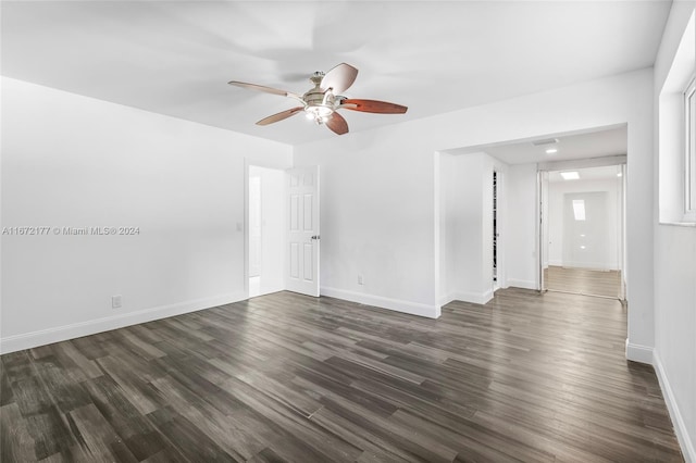 spare room featuring ceiling fan and dark hardwood / wood-style flooring