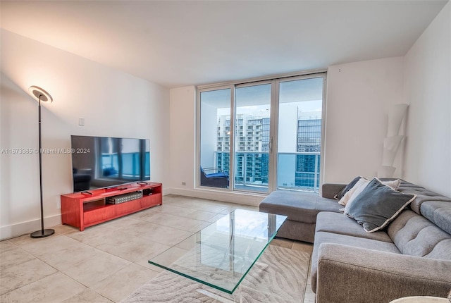 living room with light tile patterned flooring and a wall of windows